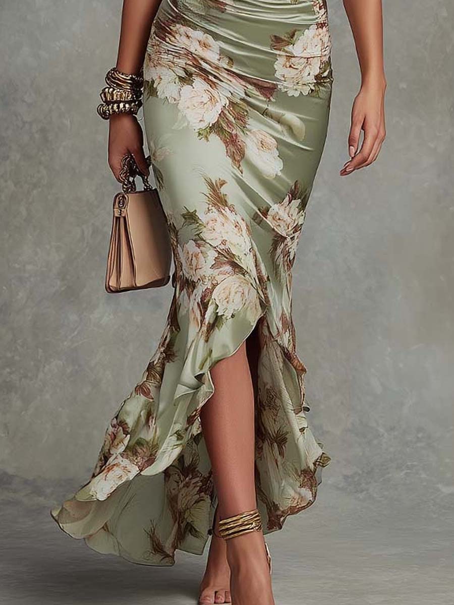 Anna | Abito lungo asimmetrico in satin verde con scollo a V, maniche a campana arricciate e motivo floreale